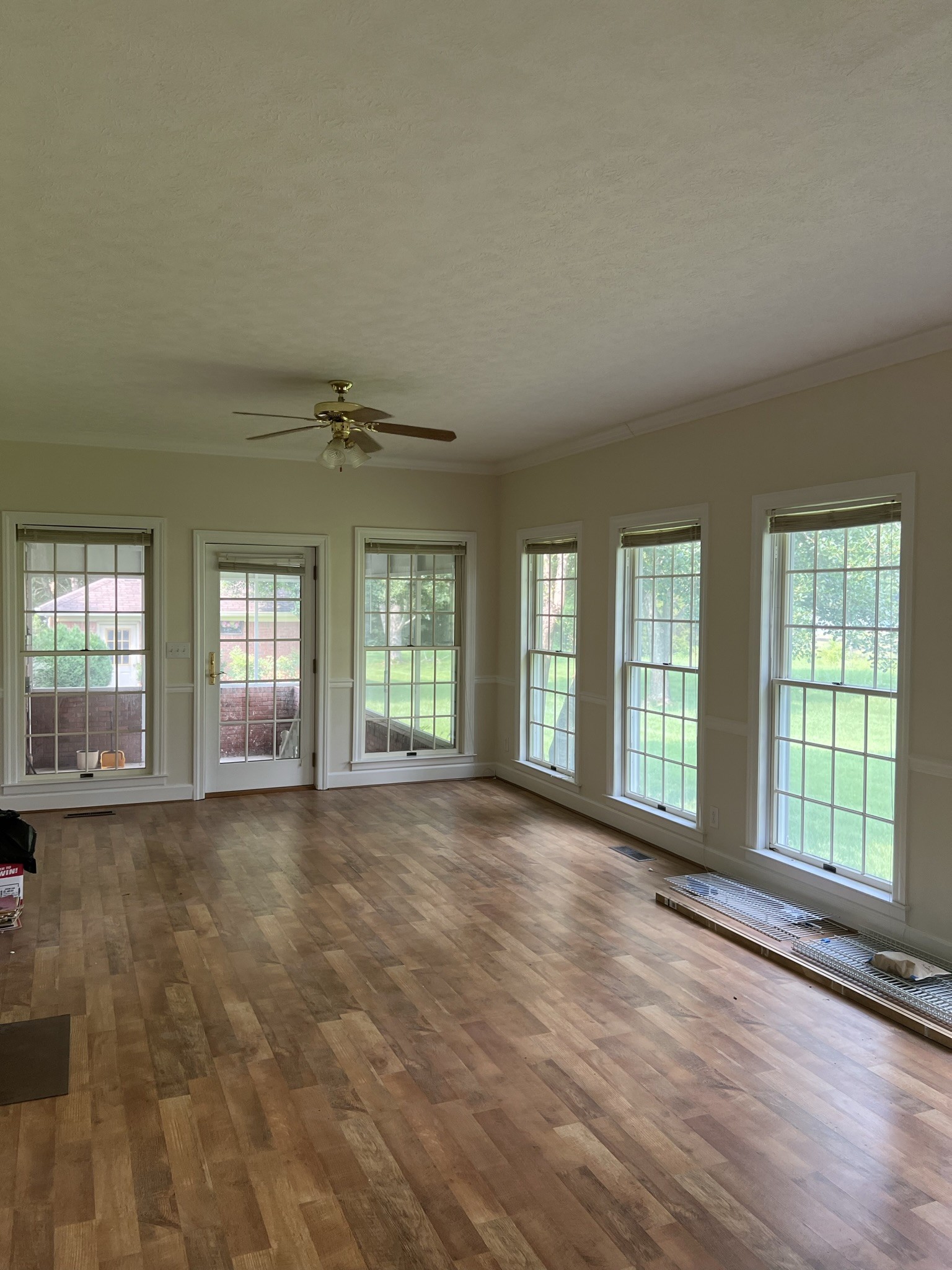 584 Corinth Road Portland, TN 37148 - Photo 22 of 42 a view of an empty room with a window and wooden floor
