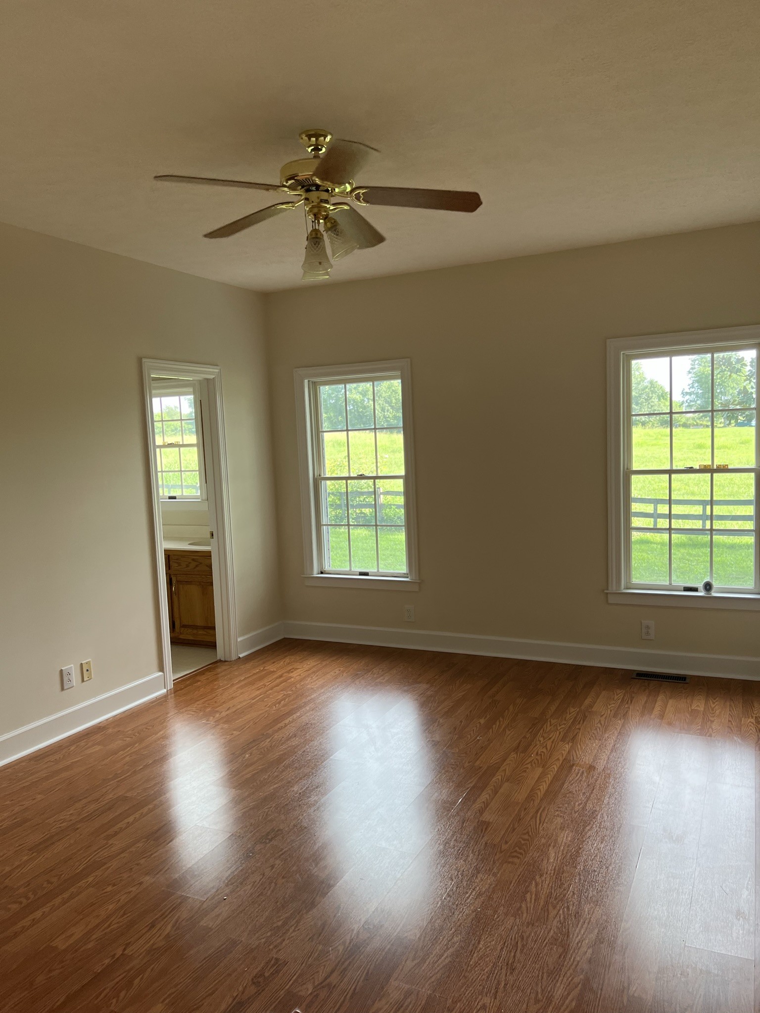 584 Corinth Road Portland, TN 37148 - Photo 27 of 42 a view of an empty room with wooden floor and a window