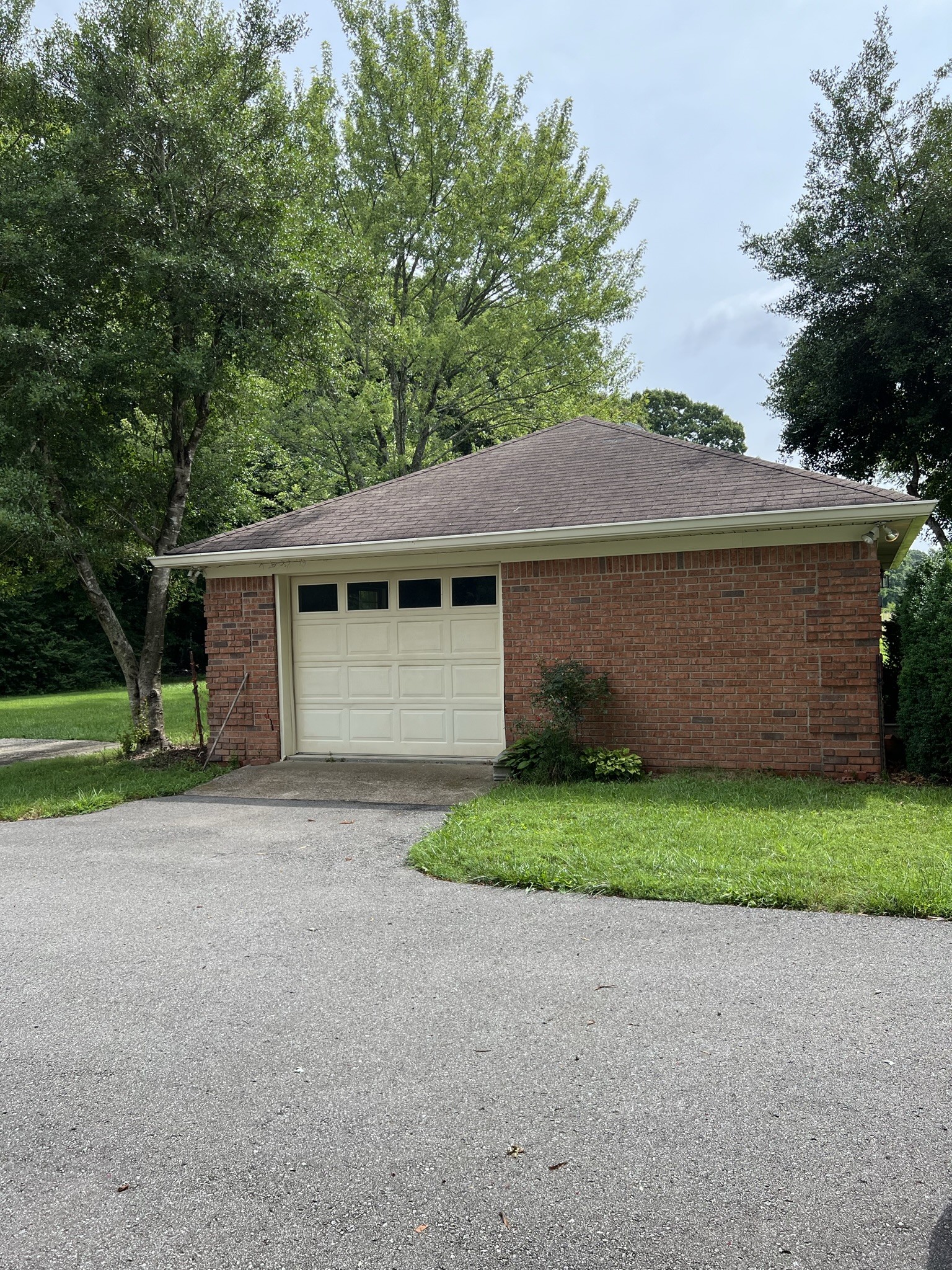 584 Corinth Road Portland, TN 37148 - Photo 3 of 42 a front view of a house with a yard and a garage