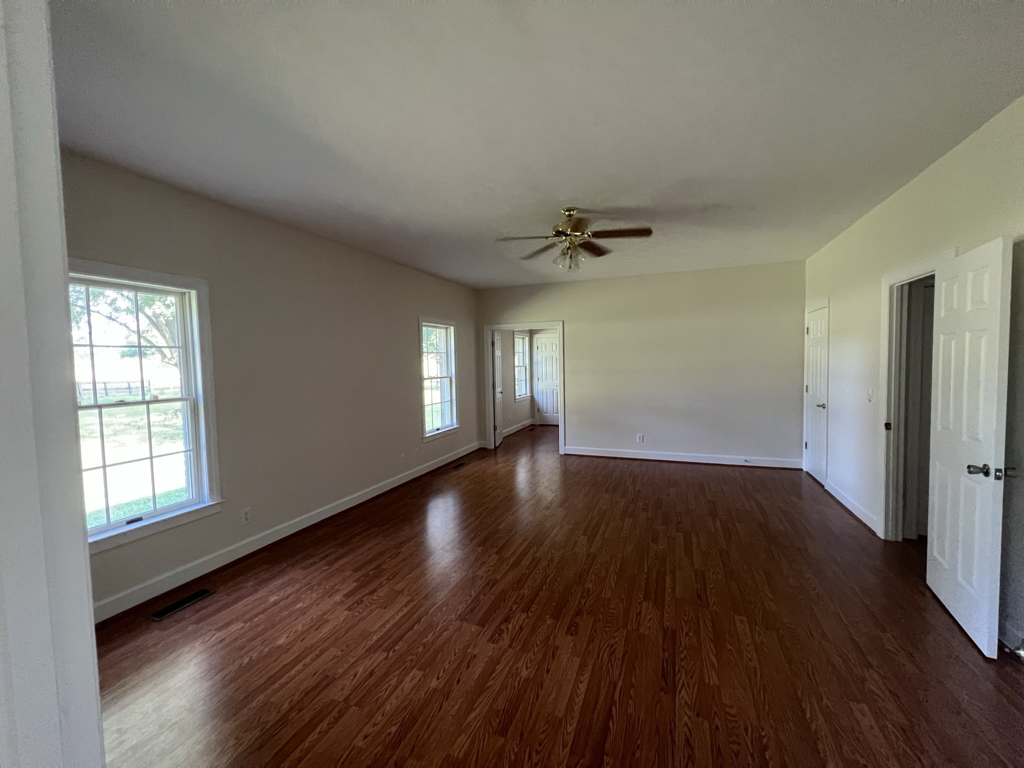 584 Corinth Road Portland, TN 37148 - Photo 31 of 42 a view of empty room with window and wooden floor