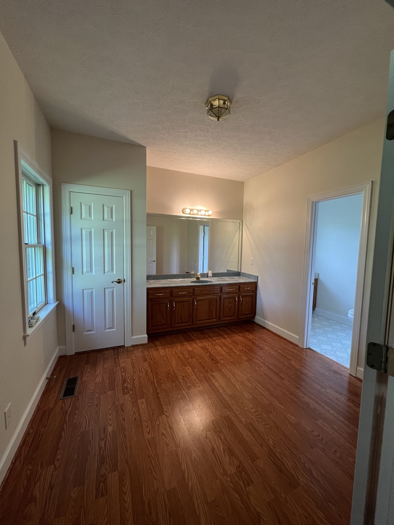 584 Corinth Road Portland, TN 37148 - Photo 33 of 42 a view of room with window and wooden floor