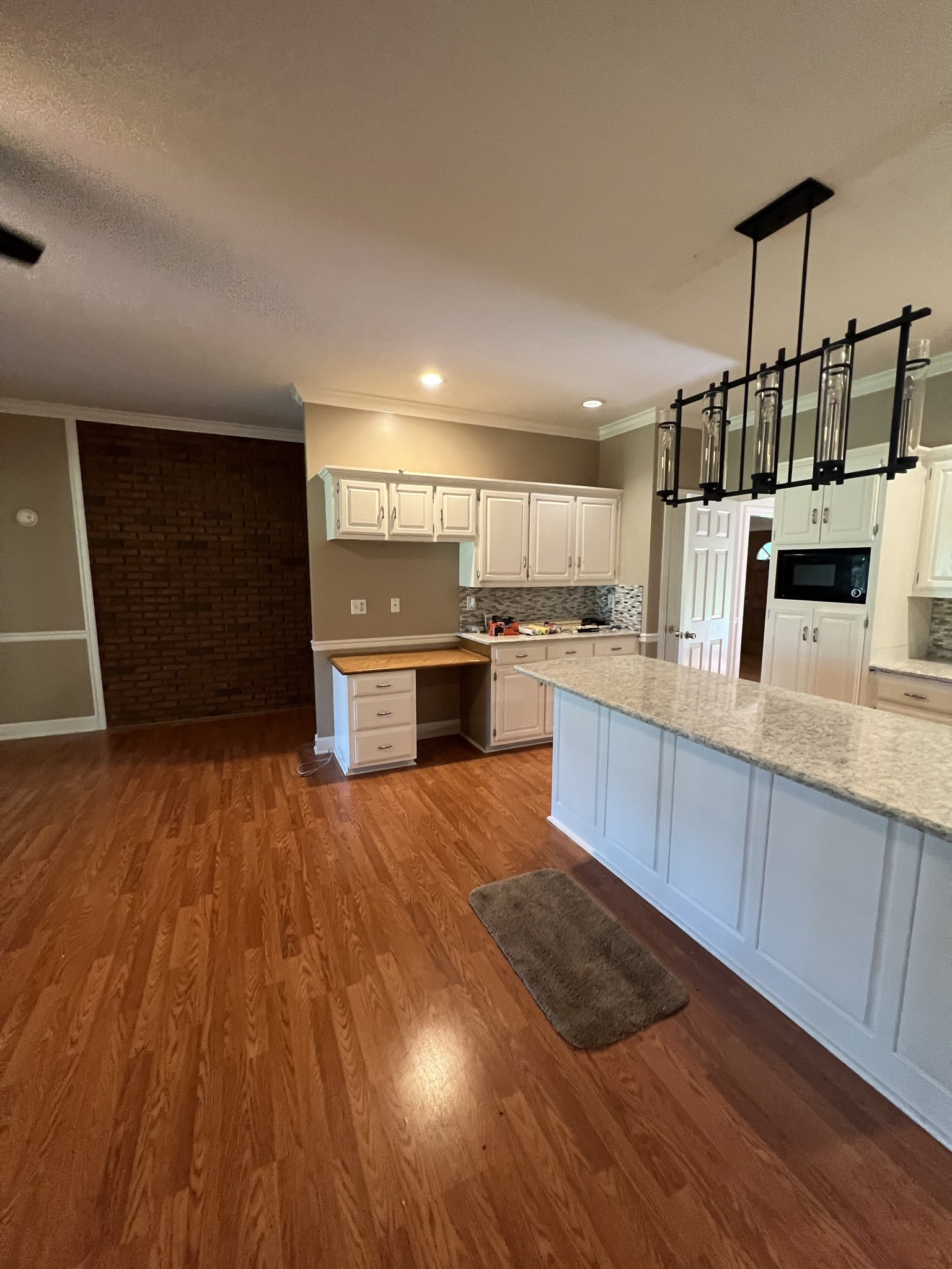 584 Corinth Road Portland, TN 37148 - Photo 41 of 42 a large kitchen with stainless steel appliances kitchen island granite countertop a stove a sink and a refrigerator