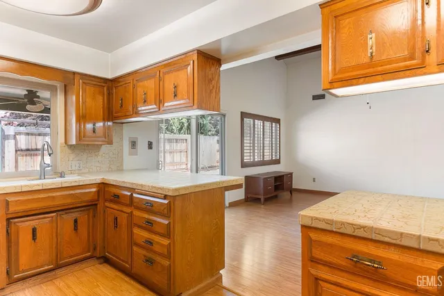 a kitchen with stainless steel appliances granite countertop a sink and cabinets