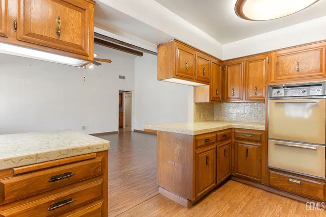 a view of entryway with white walls and open door