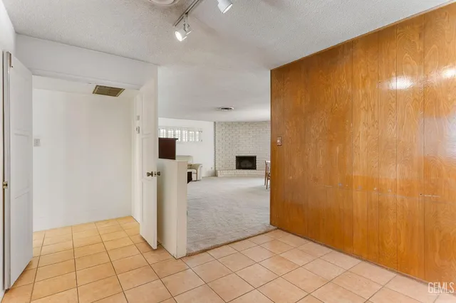 a dining room with furniture window and fireplace