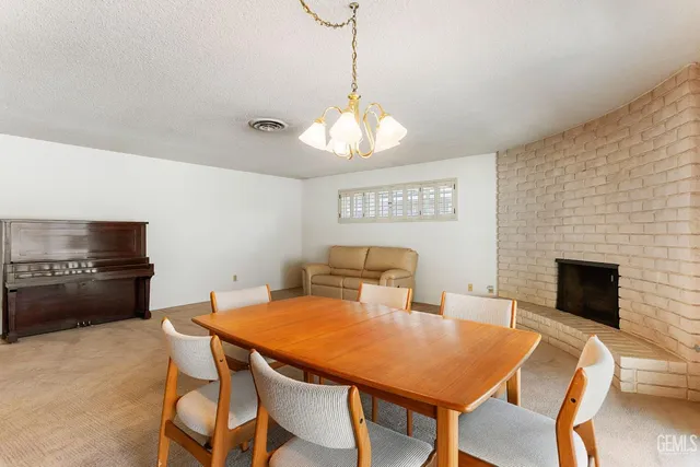 a living room with furniture a flat screen tv and a large window