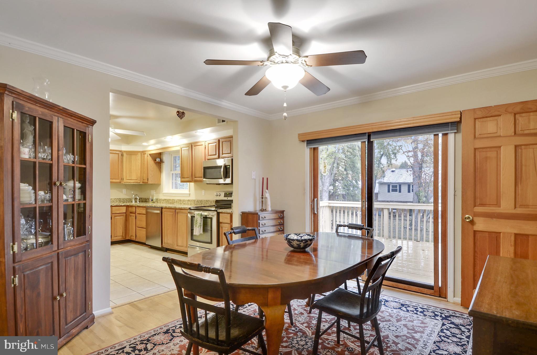 18727 Bloomfield Road Olney, MD 20832 - Photo 8 of 25 a view of a dining room with furniture window and wooden floor