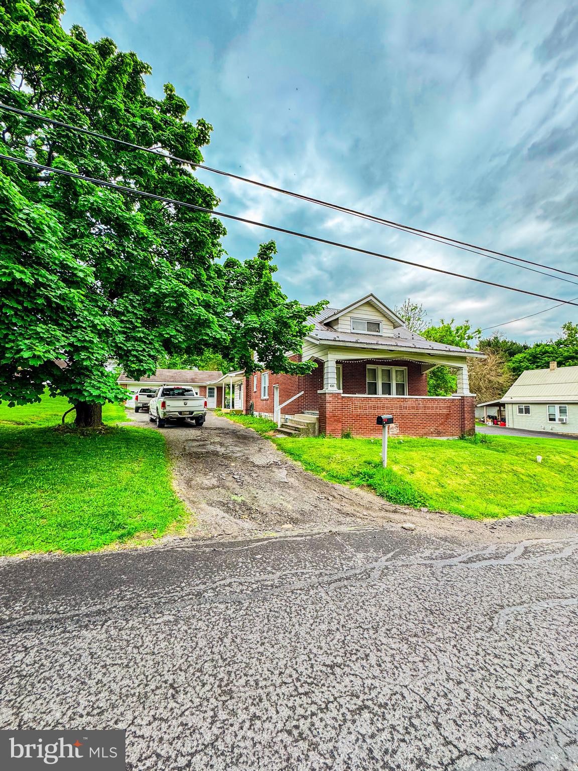 416 Dry Valley Road Burnham, PA 17009 - Photo 23 of 23 a front view of a house with a yard and garage