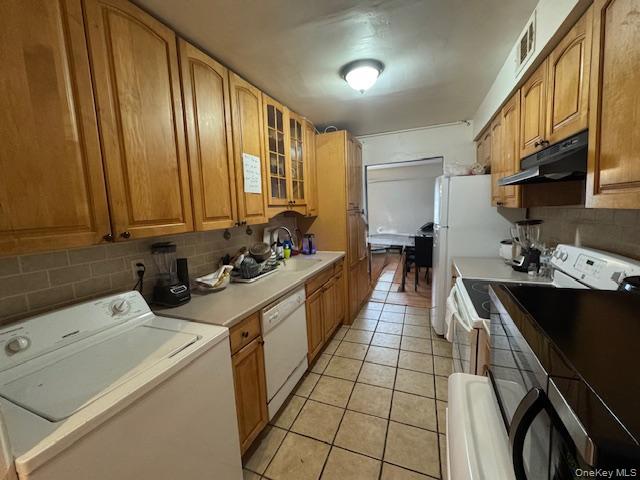 227 Hill Rise Calverton, NY 11933 - Photo 11 of 21 a kitchen with a sink a stove and cabinets