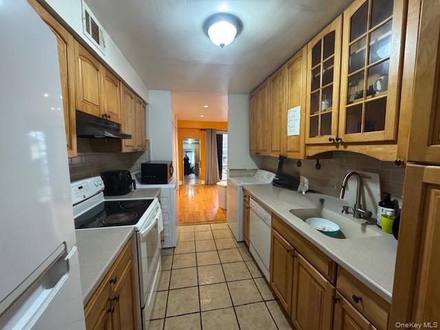 227 Hill Rise Calverton, NY 11933 - Photo 12 of 21 a kitchen with stainless steel appliances a sink stove and cabinets