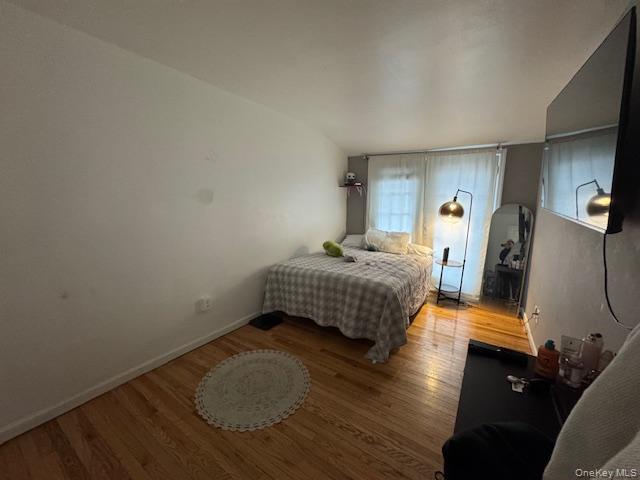 227 Hill Rise Calverton, NY 11933 - Photo 14 of 21 a bedroom with bed and window