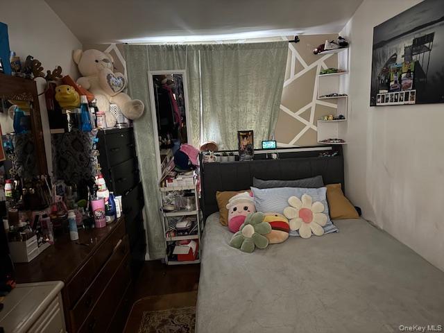 227 Hill Rise Calverton, NY 11933 - Photo 15 of 21 a bedroom with a bed and a window