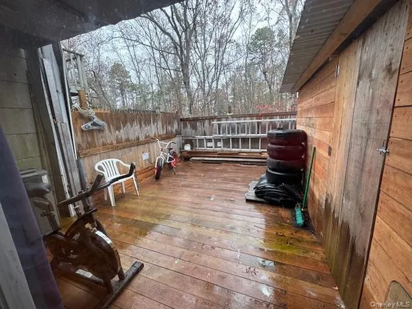 a view of a balcony with chairs