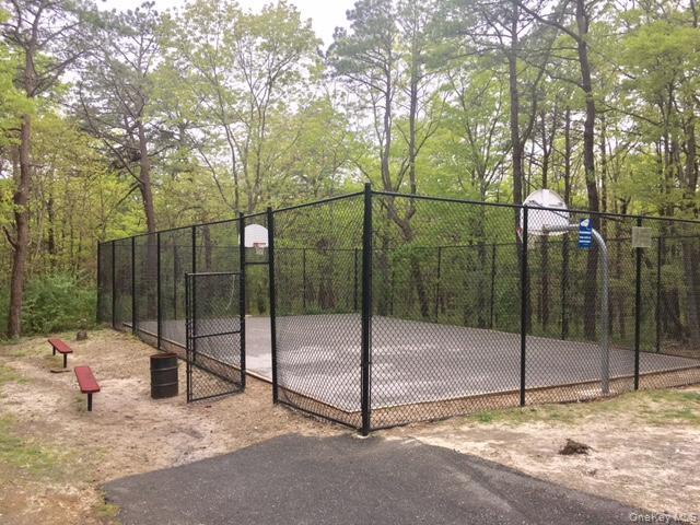 227 Hill Rise Calverton, NY 11933 - Photo 19 of 21 a backyard of a house with table and chairs