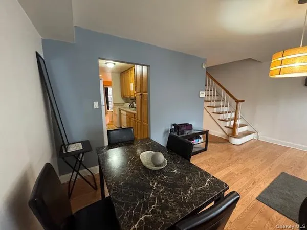 a table room with wooden floor and glass windows