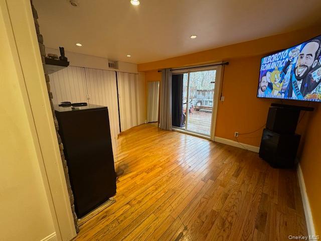 227 Hill Rise Calverton, NY 11933 - Photo 9 of 21 a view of a hallway with wooden floor and furniture