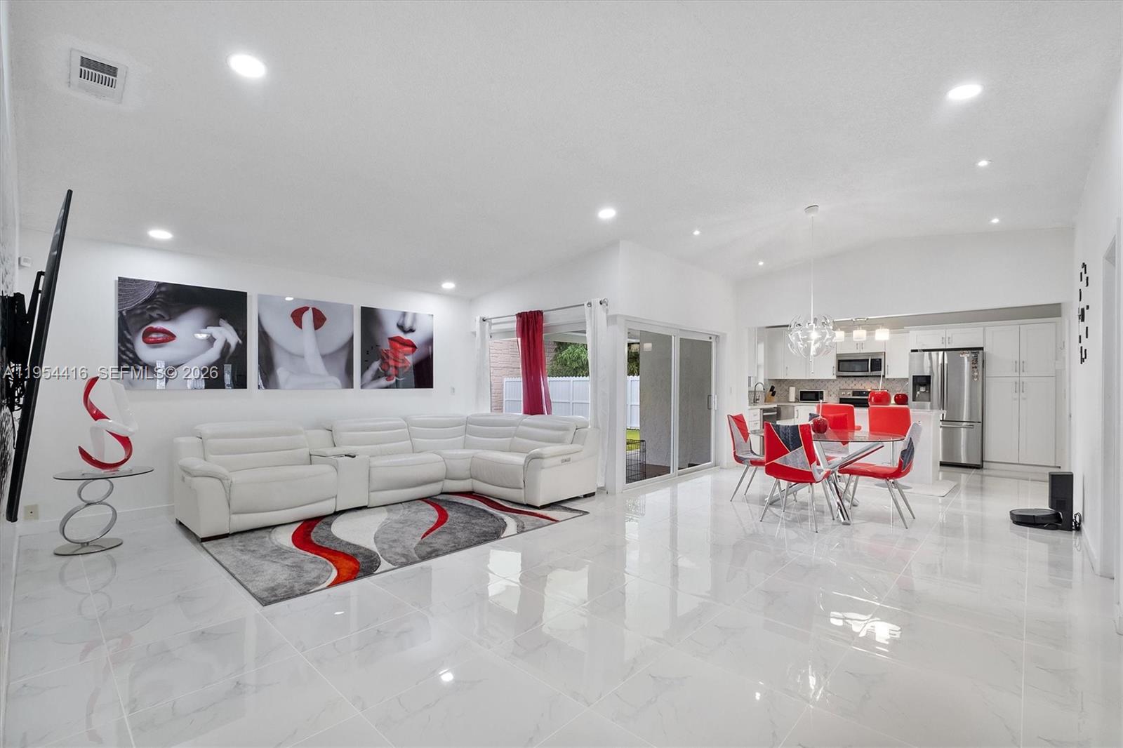 26161 Southwest 130th Avenue Homestead, FL 33032 - Photo 1 of 51 a living room with furniture and air hockey table