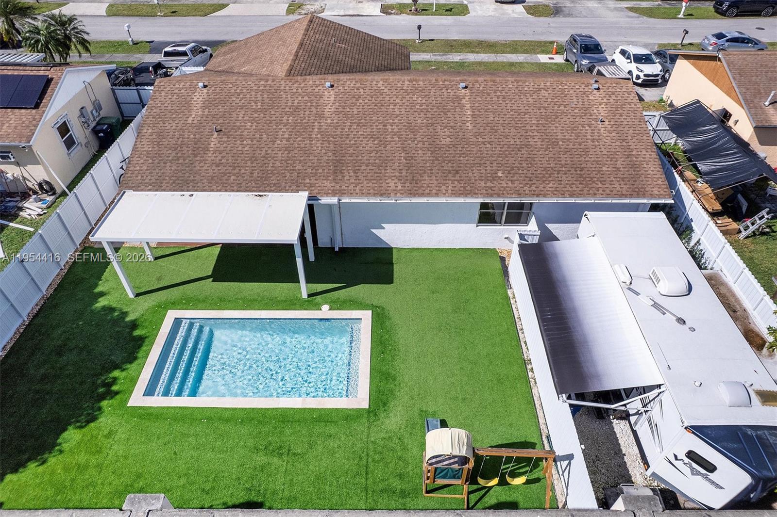 26161 Southwest 130th Avenue Homestead, FL 33032 - Photo 46 of 51 RV parked with access to patio independent entrance.