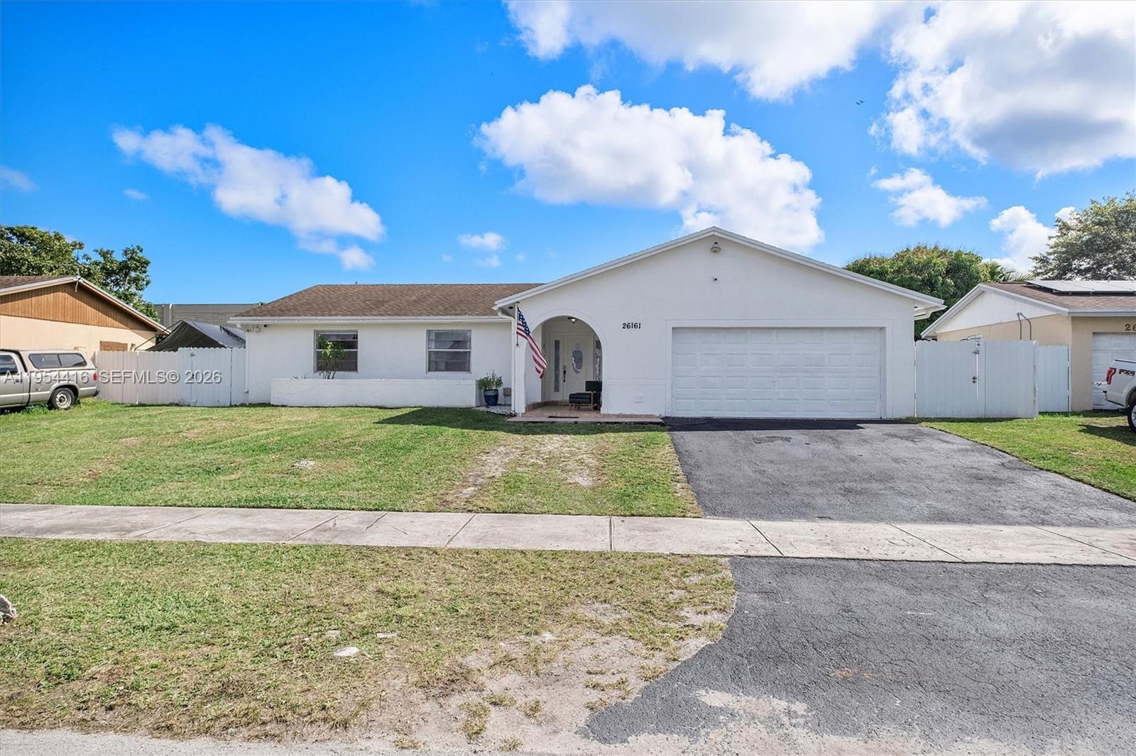 26161 Southwest 130th Avenue Homestead, FL 33032 - Photo 7 of 51 a front view of house with yard
