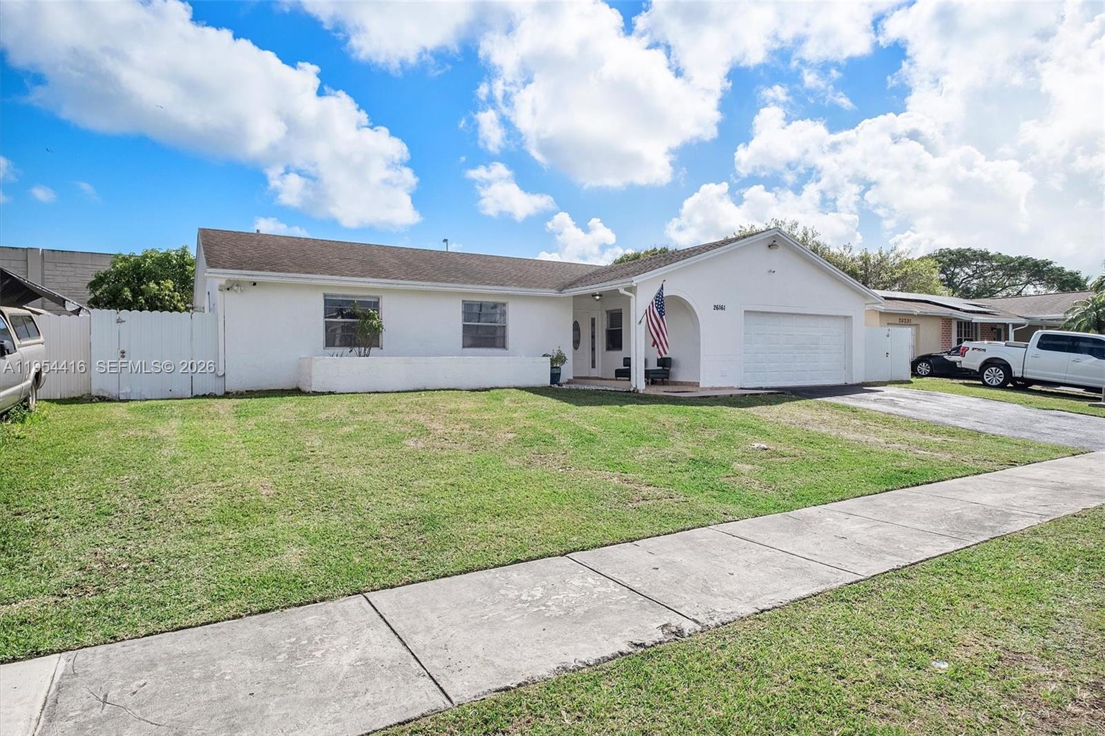 26161 Southwest 130th Avenue Homestead, FL 33032 - Photo 8 of 51 a view of a house with a yard and sitting area