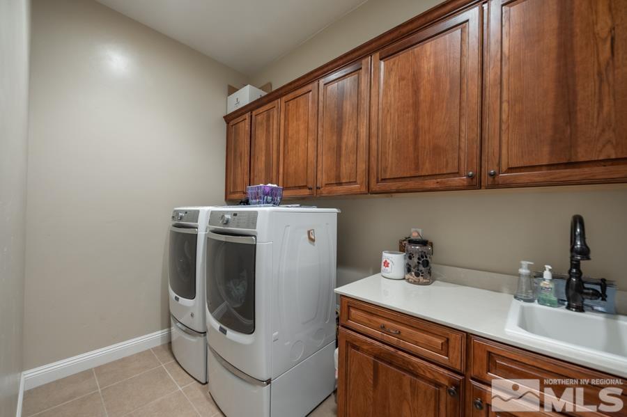 9750 Thesolious Lane Reno, NV 89521 - Photo 23 of 40 a utility room with dryer and washer