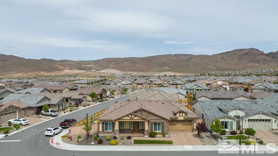 9750 Thesolious Lane Reno, NV 89521 - Photo 3 of 40 an aerial view of residential houses and a road
