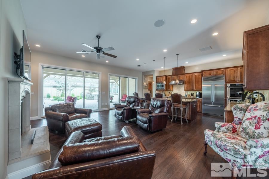 9750 Thesolious Lane Reno, NV 89521 - Photo 6 of 40 a living room with furniture kitchen view and a large window
