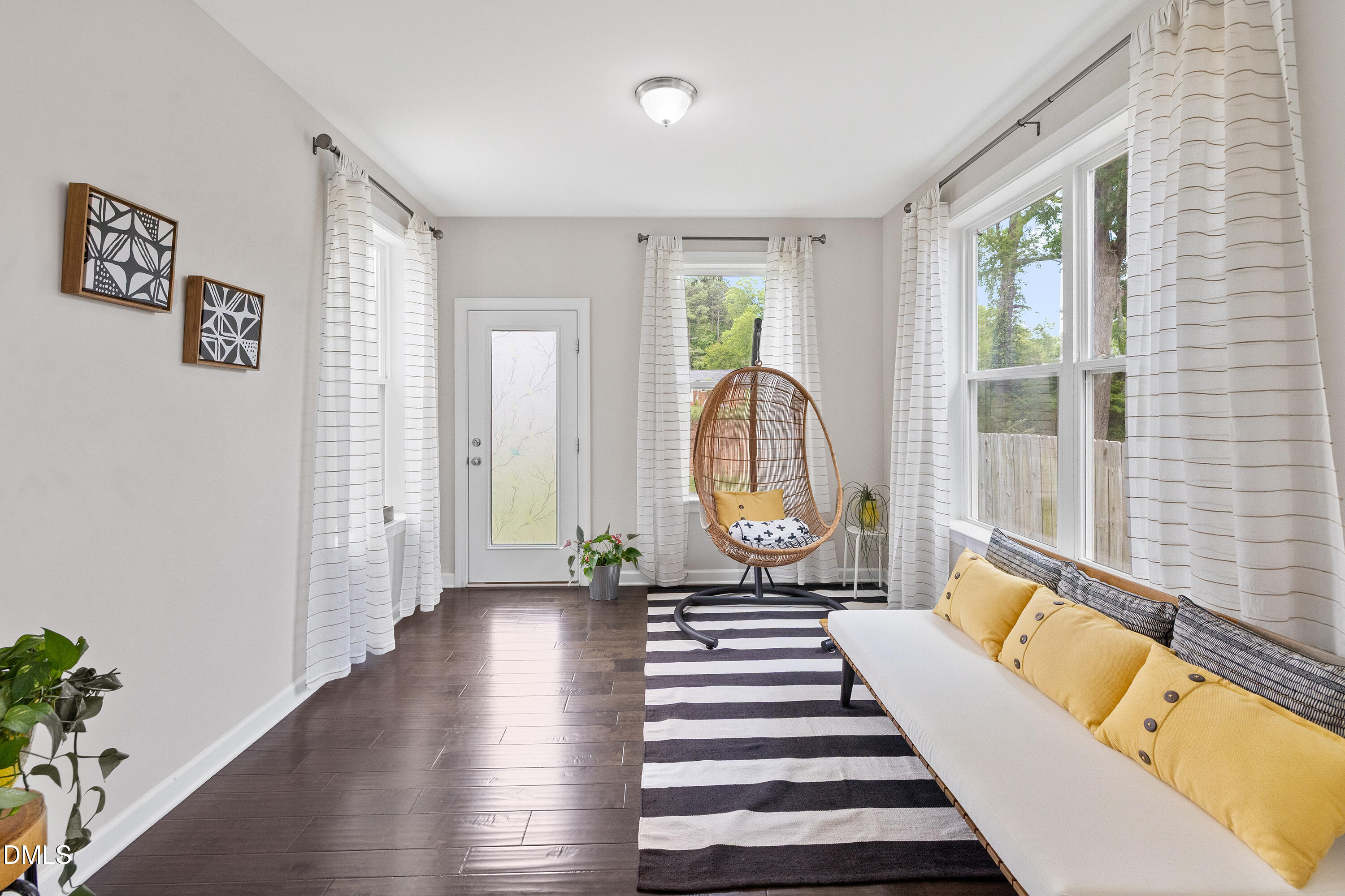 8059 Gilano Drive Raleigh, NC 27603 - Photo 6 of 43 a living room with furniture and a large window