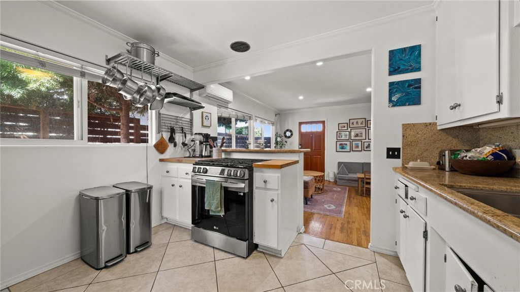 1406 17th Street Manhattan Beach, CA 90266 - Photo 12 of 60 a kitchen with stainless steel appliances granite countertop a stove and a refrigerator