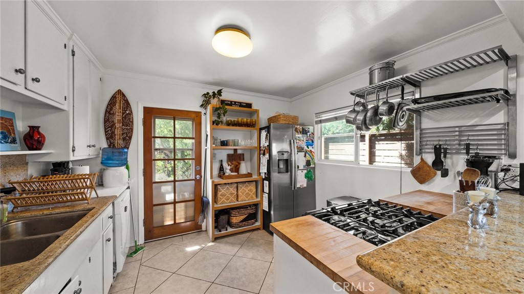 1406 17th Street Manhattan Beach, CA 90266 - Photo 13 of 60 a kitchen with stainless steel appliances granite countertop a stove and a refrigerator