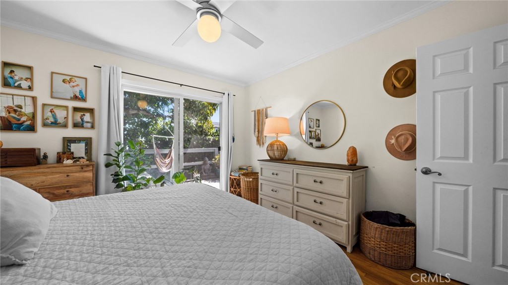1406 17th Street Manhattan Beach, CA 90266 - Photo 15 of 60 a bedroom with a bed and a chandelier