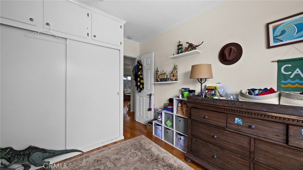 1406 17th Street Manhattan Beach, CA 90266 - Photo 21 of 60 a bed room with a bed and a dresser