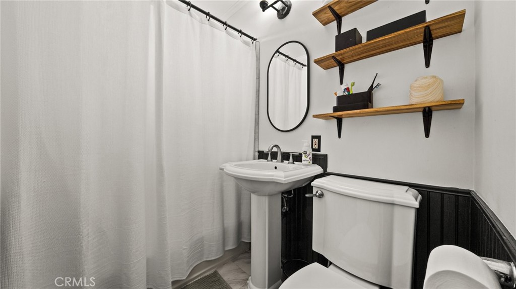 1406 17th Street Manhattan Beach, CA 90266 - Photo 23 of 60 a bathroom with a sink and mirror