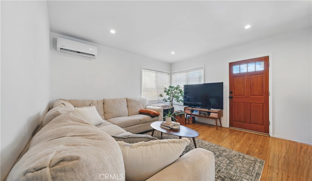 1406 17th Street Manhattan Beach, CA 90266 - Photo 29 of 60 a living room with furniture and a flat screen tv
