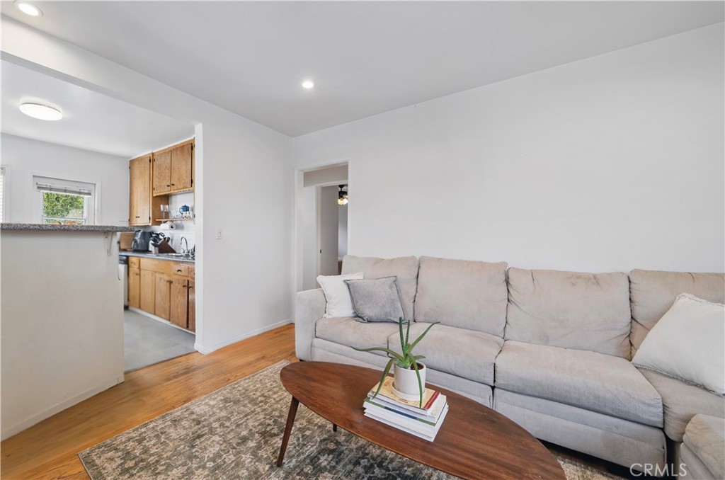 1406 17th Street Manhattan Beach, CA 90266 - Photo 31 of 60 a living room with furniture and wooden floor