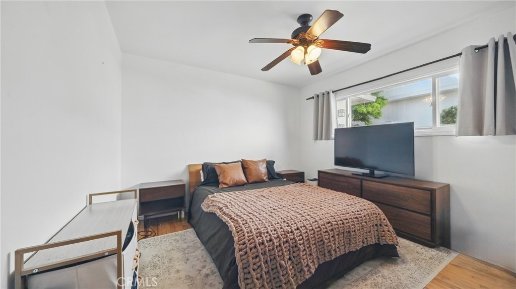 1406 17th Street Manhattan Beach, CA 90266 - Photo 39 of 60 a bedroom with a bed and a flat screen tv