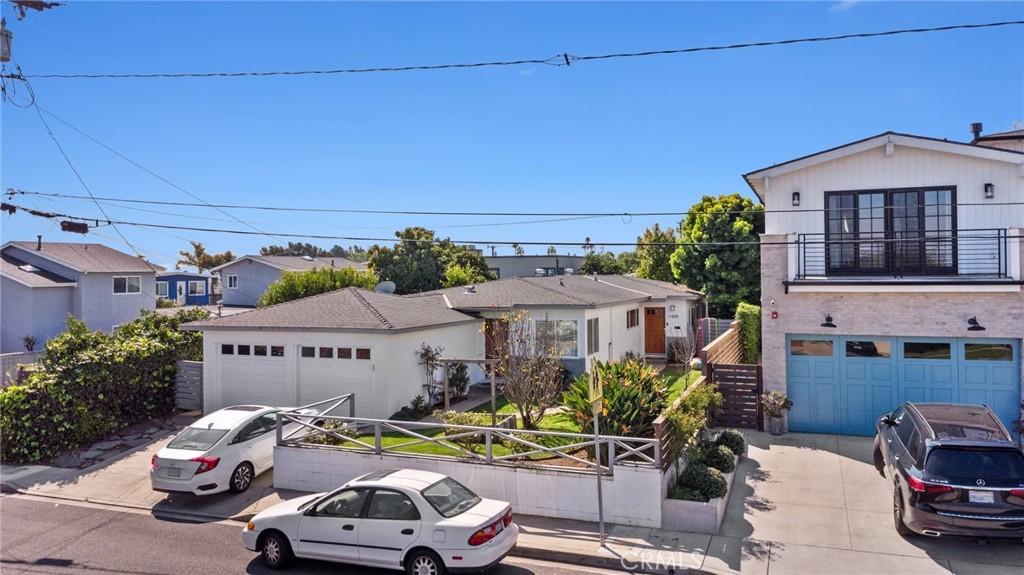 1406 17th Street Manhattan Beach, CA 90266 - Photo 47 of 60 a car parked in front of a building