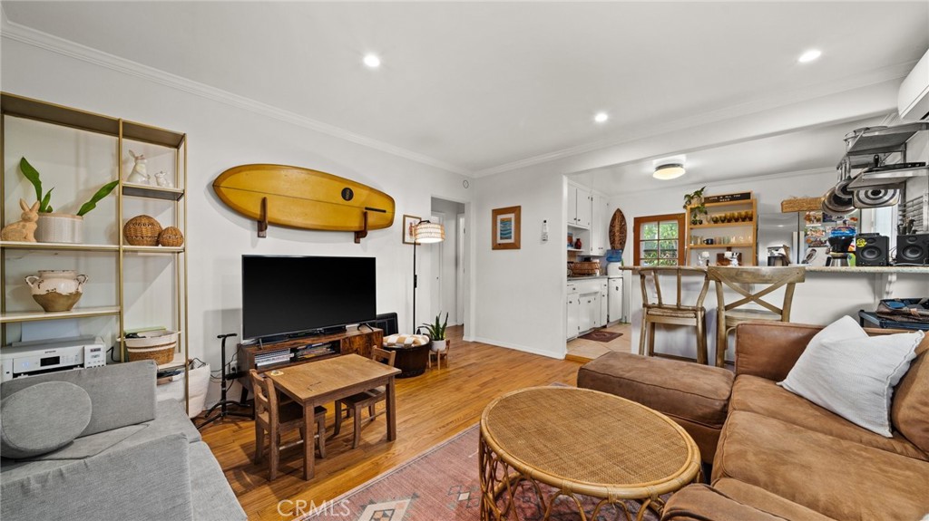 1406 17th Street Manhattan Beach, CA 90266 - Photo 7 of 60 a living room with furniture a flat screen tv and a fireplace