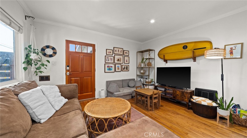 1406 17th Street Manhattan Beach, CA 90266 - Photo 9 of 60 a living room with furniture and a flat screen tv