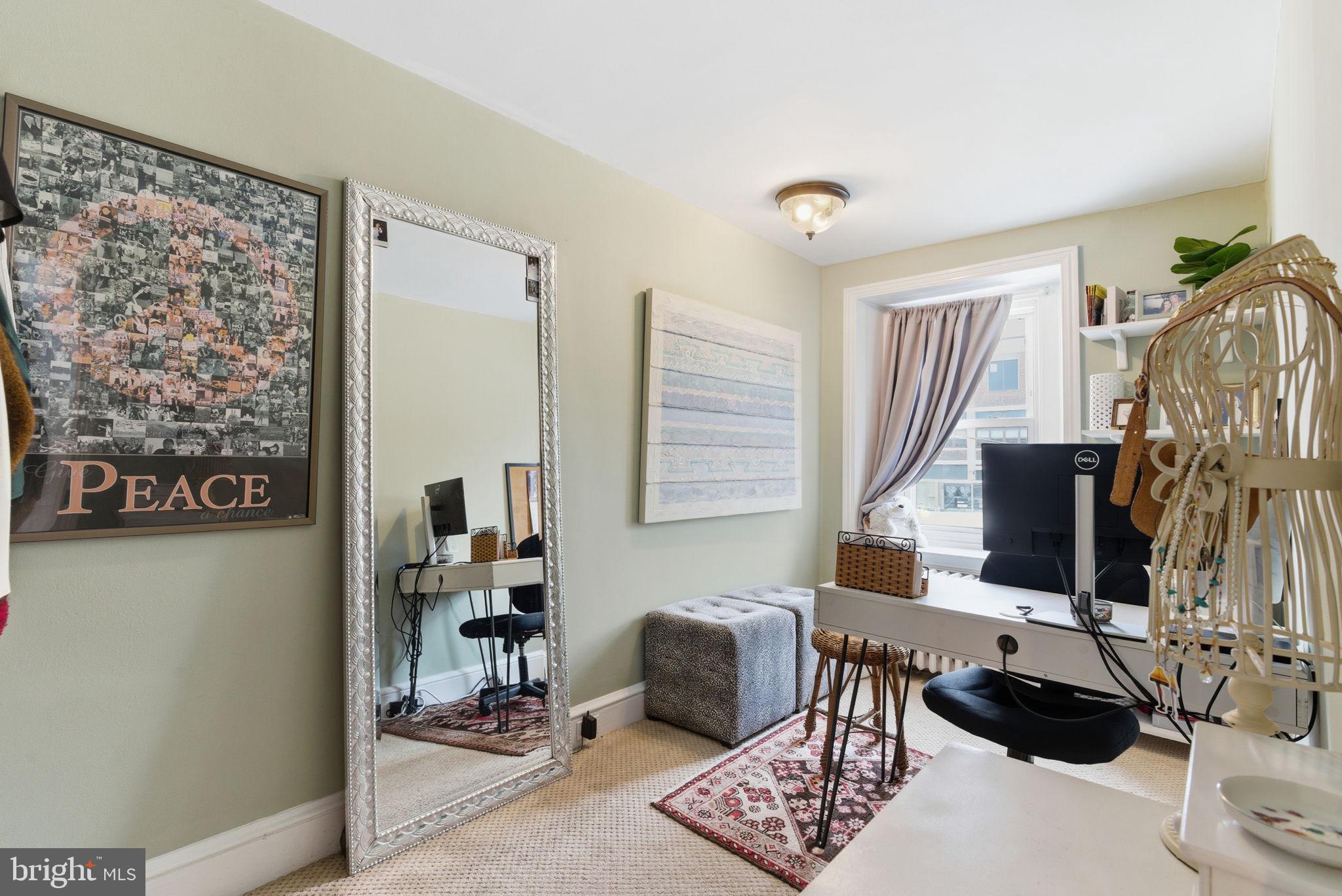 405 Leverington Avenue Philadelphia, PA 19128 - Photo 18 of 25 a living room with furniture and a window