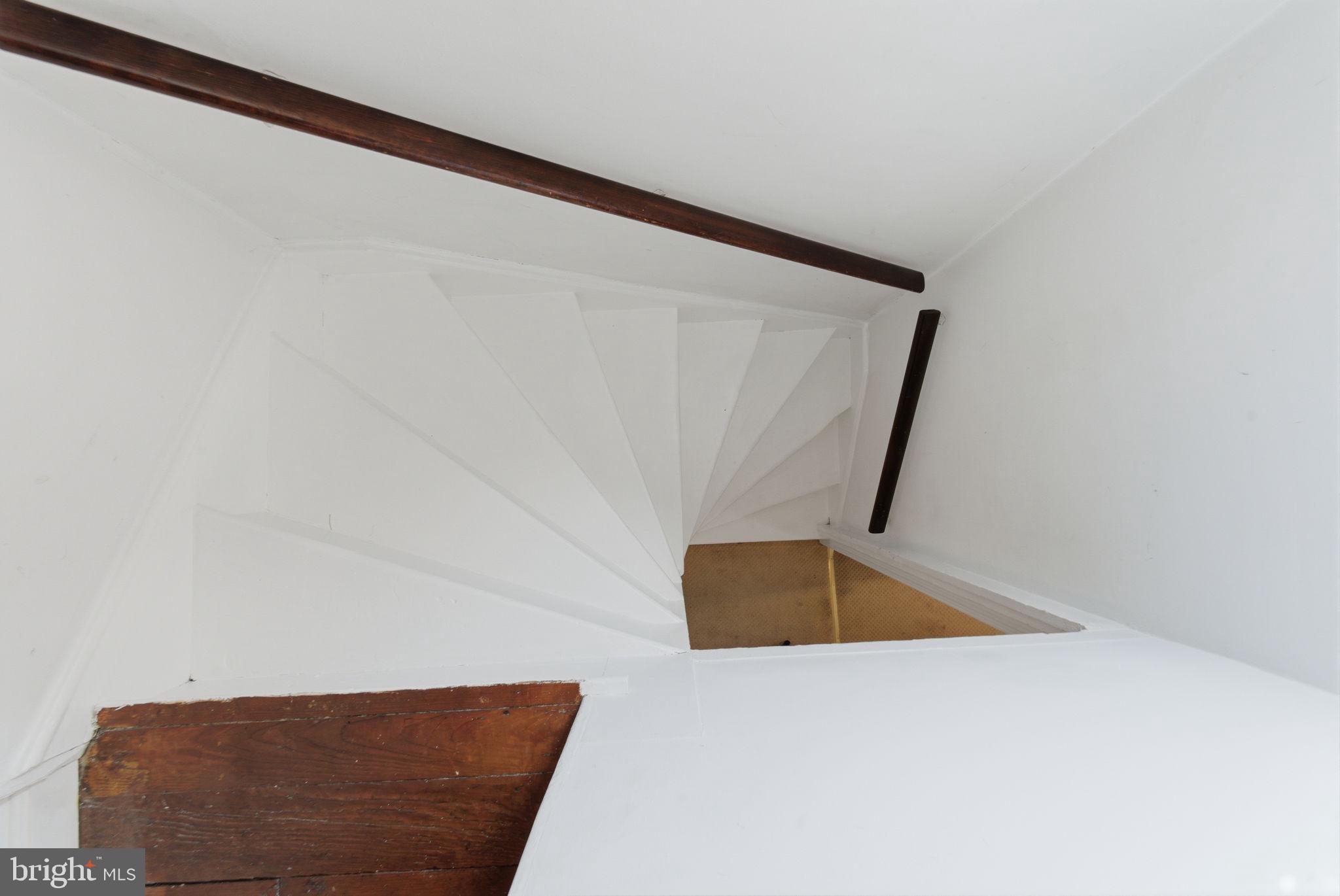 405 Leverington Avenue Philadelphia, PA 19128 - Photo 19 of 25 a view of staircase with wooden floor and tub