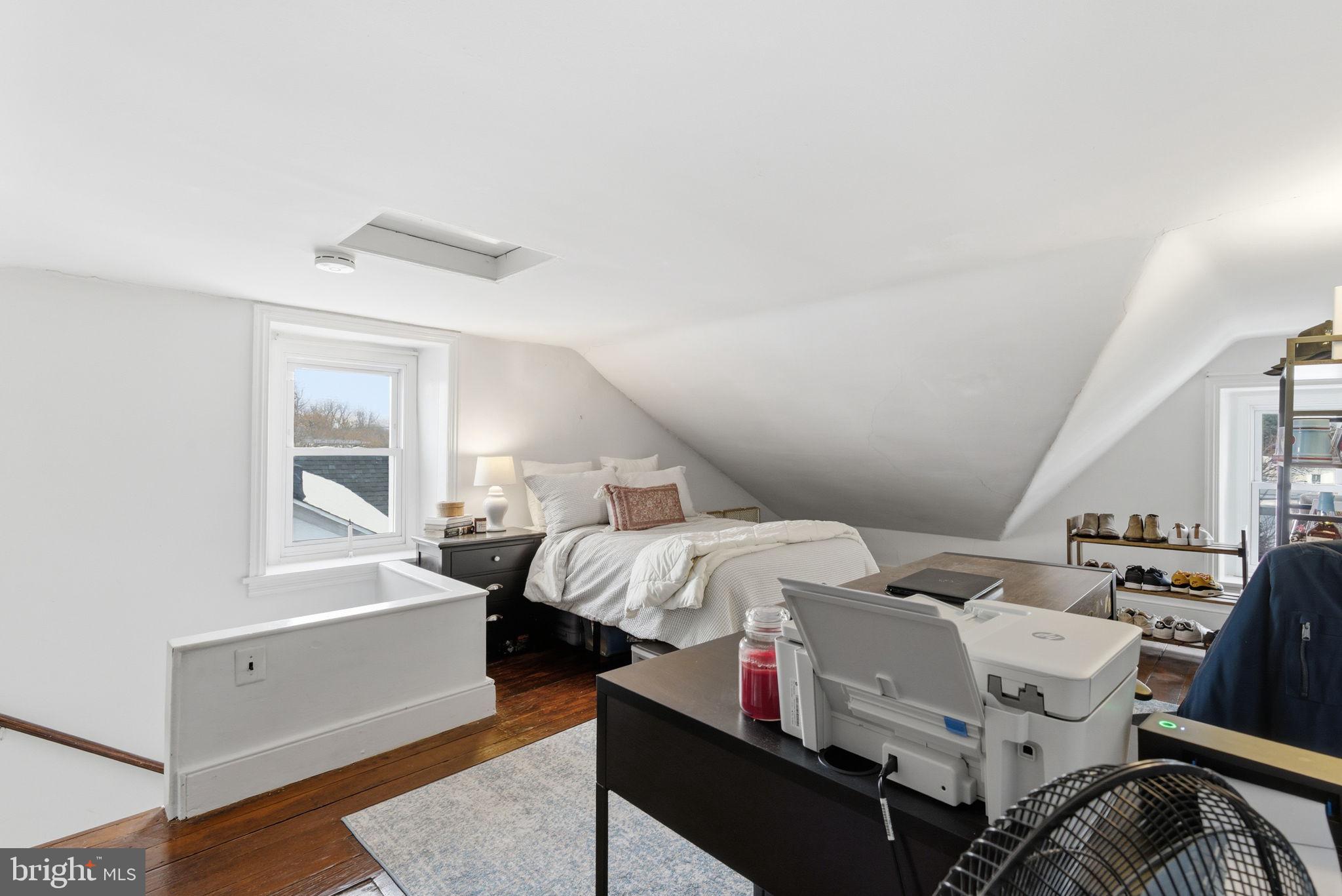 405 Leverington Avenue Philadelphia, PA 19128 - Photo 21 of 25 a bed room with a bed and a window