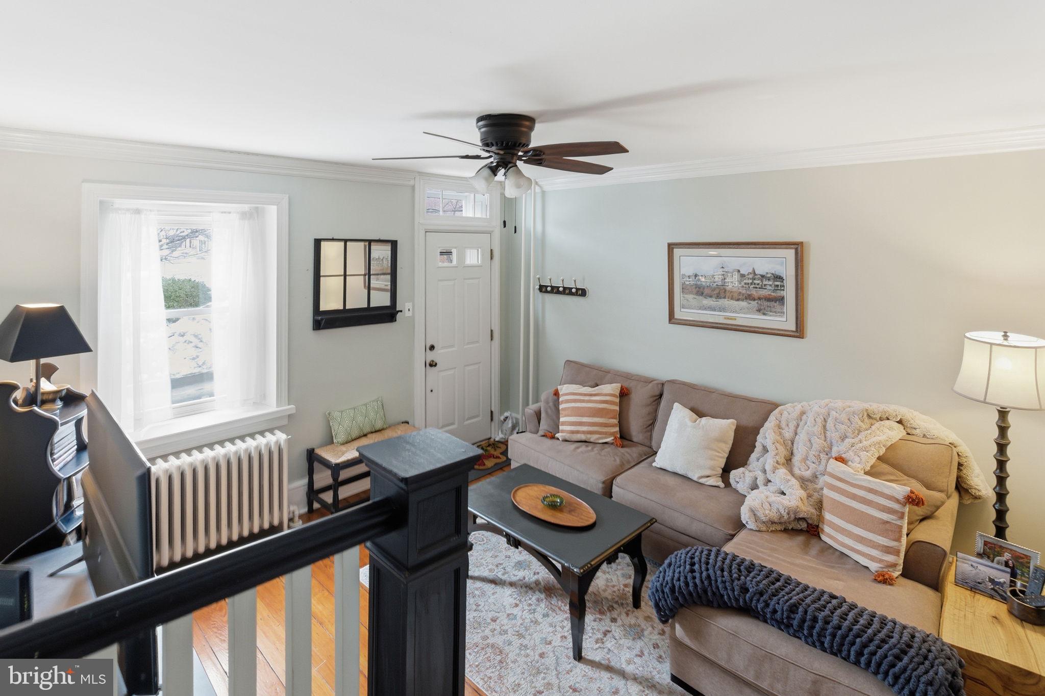 405 Leverington Avenue Philadelphia, PA 19128 - Photo 5 of 25 a living room with furniture and a window