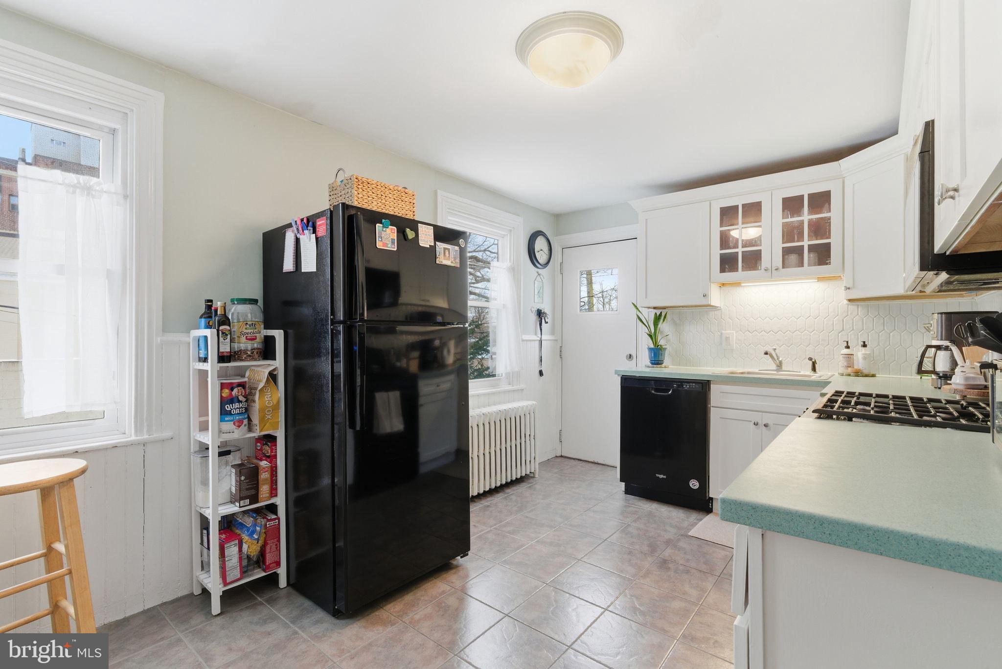 405 Leverington Avenue Philadelphia, PA 19128 - Photo 9 of 25 a kitchen with a refrigerator and a sink