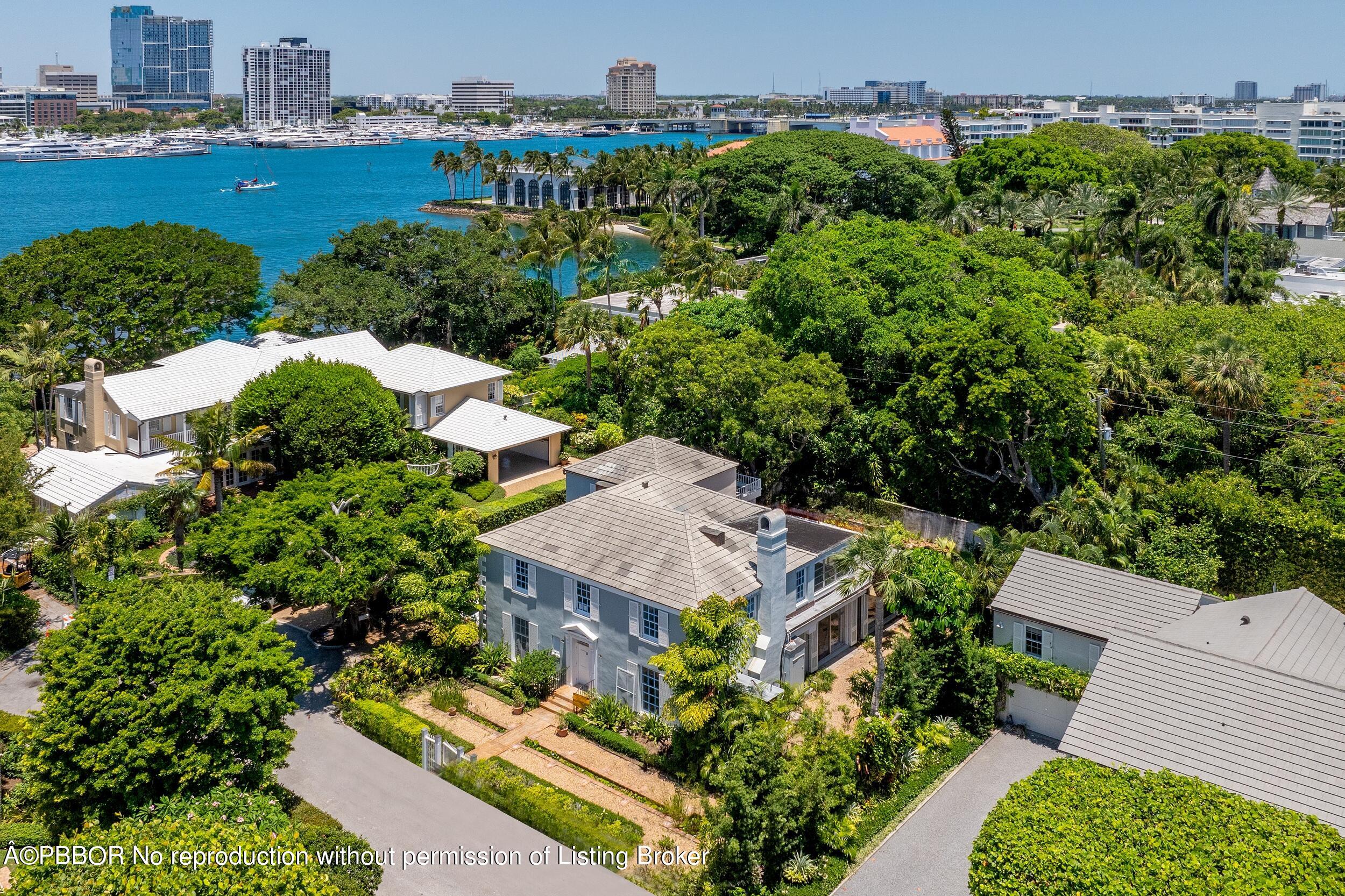 an aerial view of a house with yard and outdoor seating