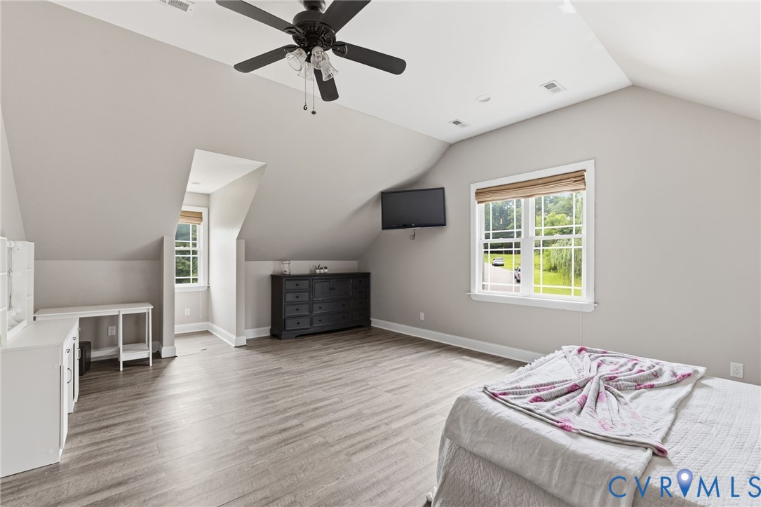 15220 River Road Chesterfield, VA 23838 - Photo 31 of 65 Attic room with sloped ceilings and wood-finish fl