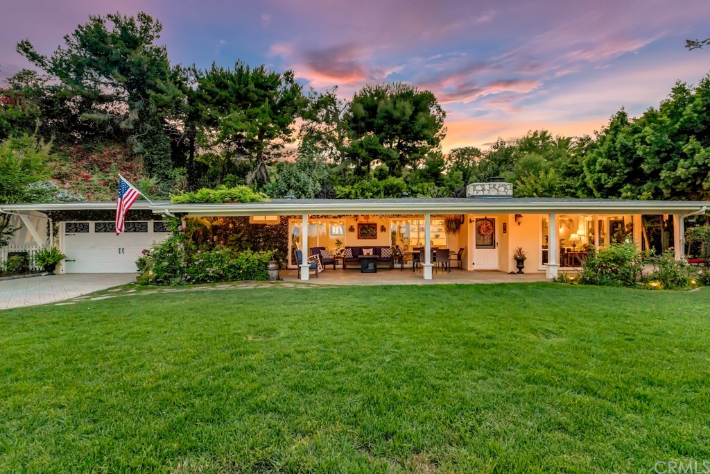a view of yard with swimming pool and green space