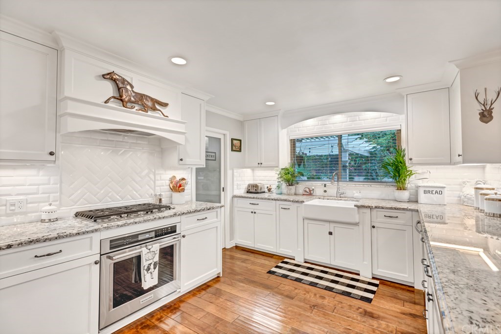 2601 Sunnyside Ridge Road Rancho Palos Verdes, CA 90275 - Photo 14 of 47 a kitchen with granite countertop cabinets and steel stainless steel appliances