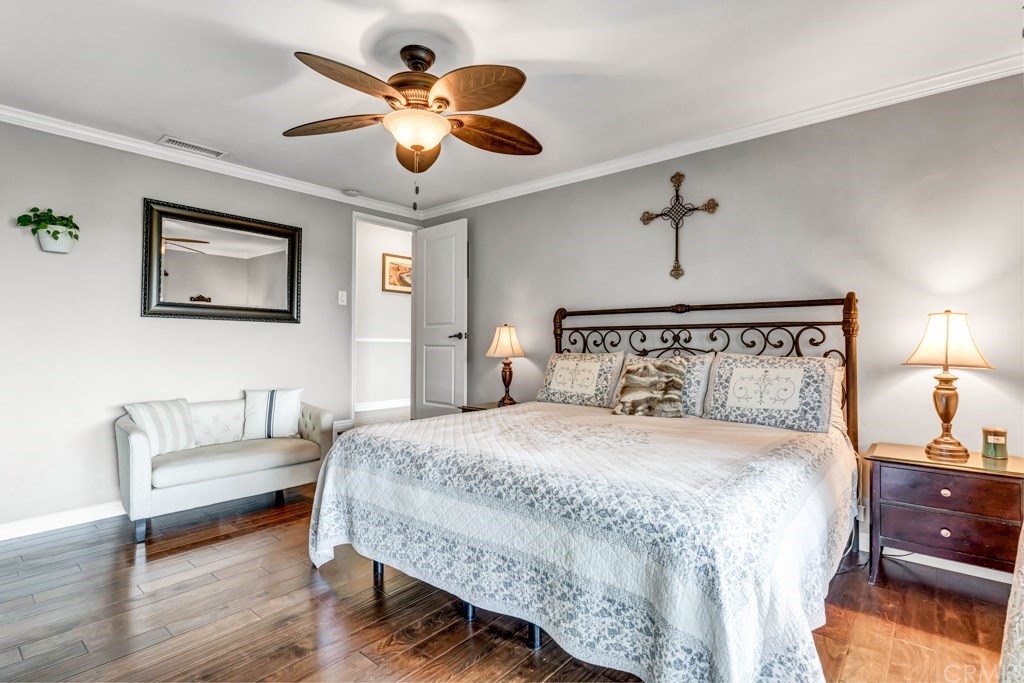 2601 Sunnyside Ridge Road Rancho Palos Verdes, CA 90275 - Photo 22 of 47 a bedroom with a bed and a chandelier