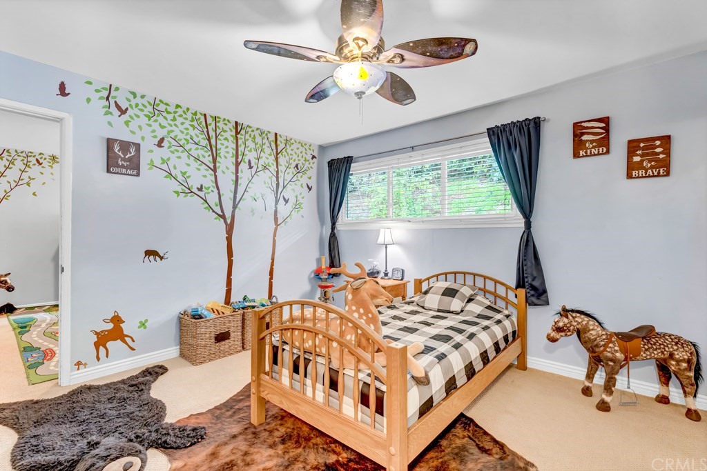 2601 Sunnyside Ridge Road Rancho Palos Verdes, CA 90275 - Photo 25 of 47 a bedroom with furniture and a large window
